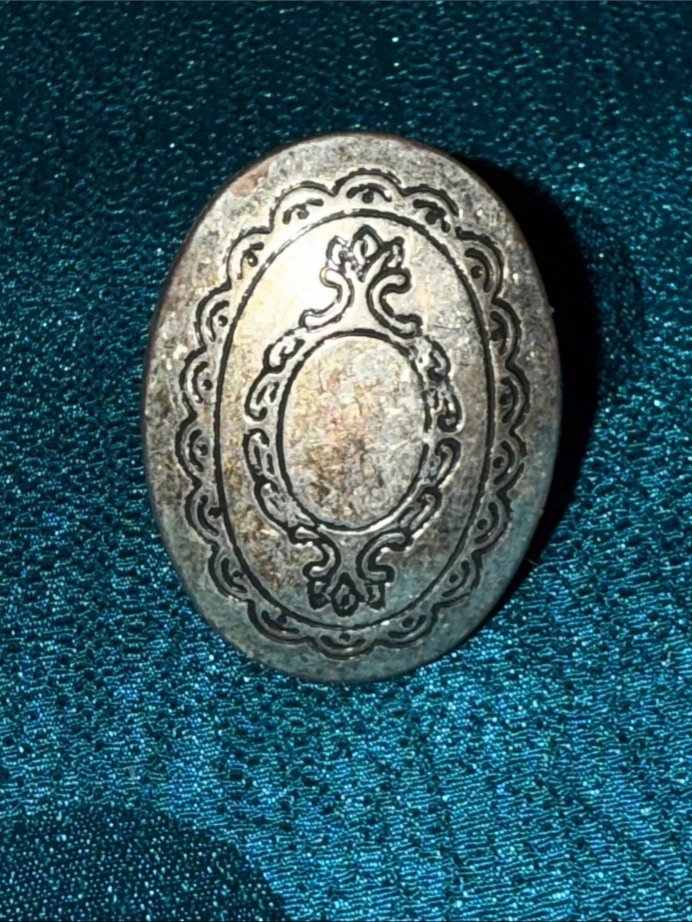 Silver colored locket ring